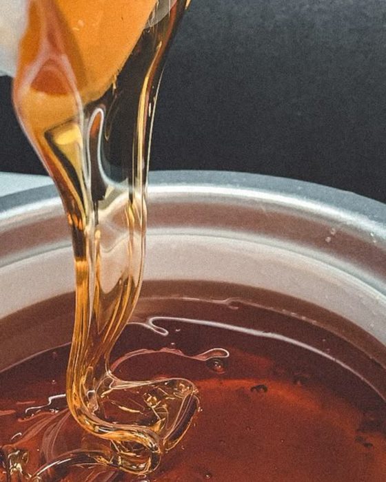 Warm wax being prepared for a waxing treatment